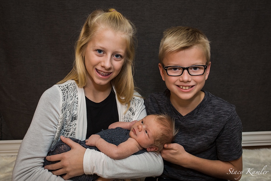 Siblings with Newborn Brother in Studio