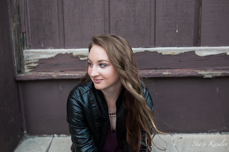 Nebraska Senior with long brown hair and leather jacket