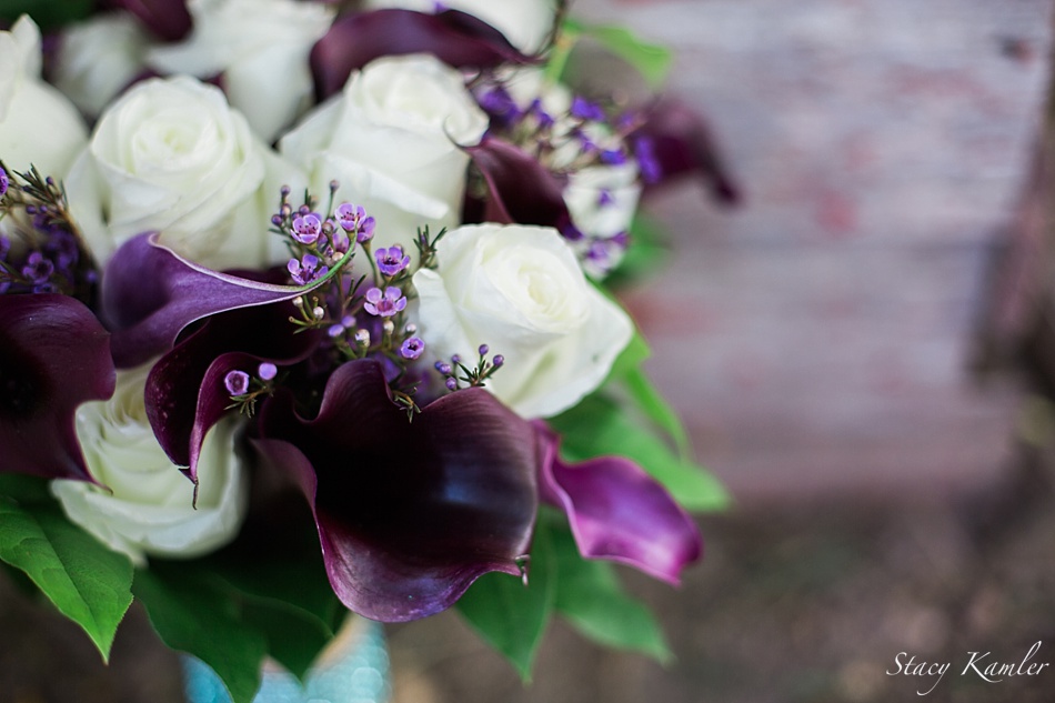 Purple flowers in brides bouquet