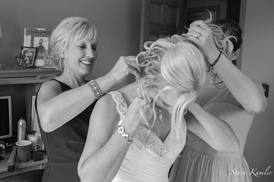 Mom putting on Brides necklace