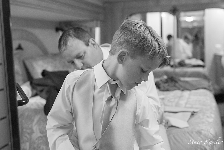 Dad helping son with tux