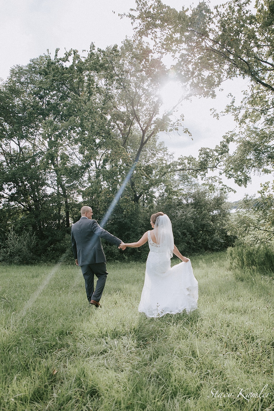 Bride and Groom portrait with sun flare