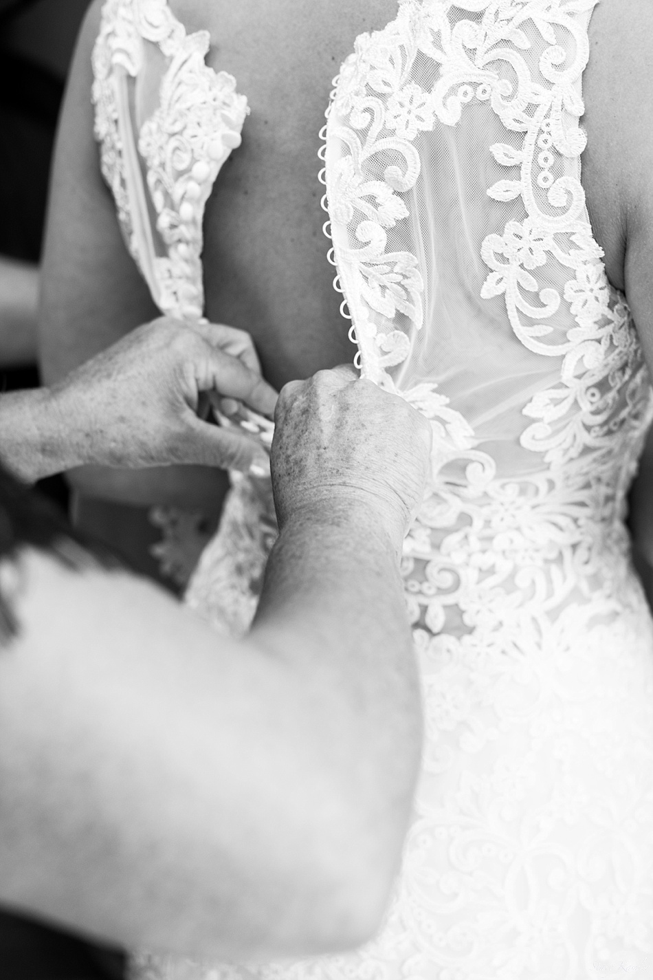 Bride Getting Dressed in a lace Dress