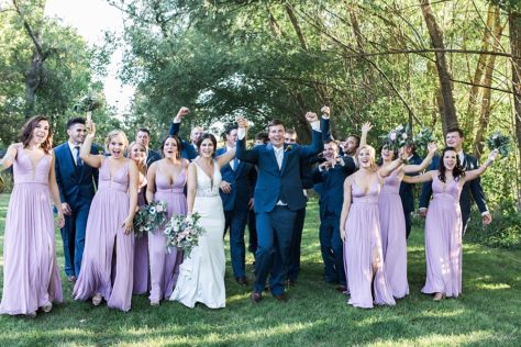 Bridal Party with blue tuxes and purple dresses