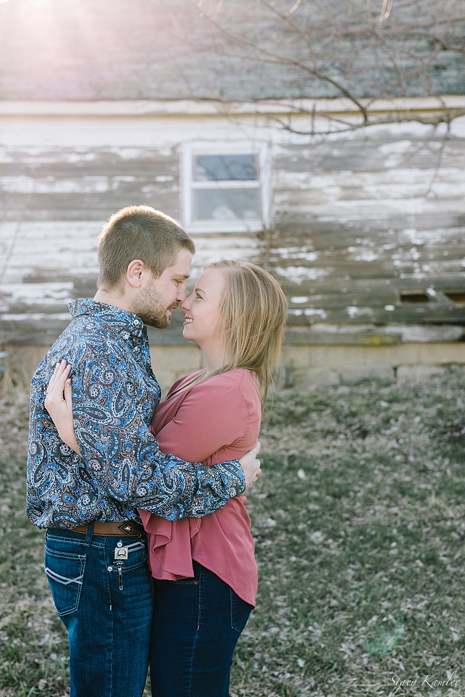 Engagement photos with old white barn