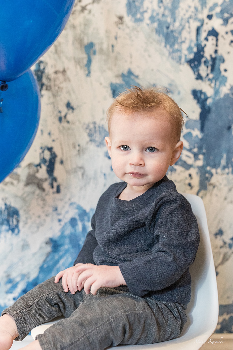 One year old with balloons