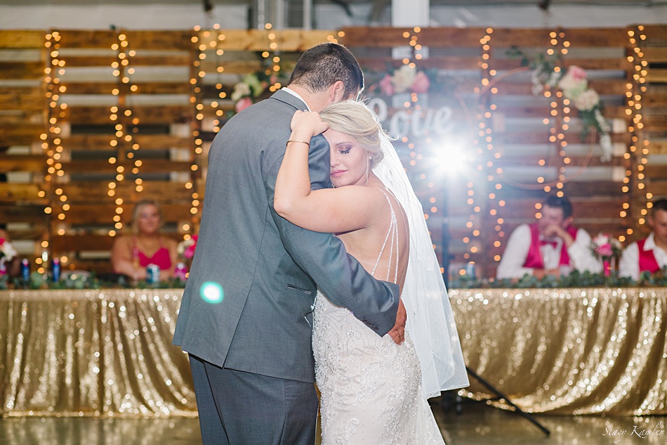 Bride and Groom cuddling with first dance