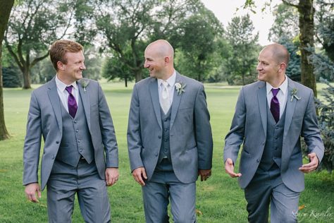 Groomsmen laughing during their portraits