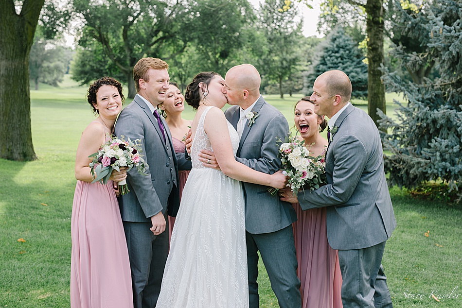 Grey tuxes and dusty pink dresses for the bridal party