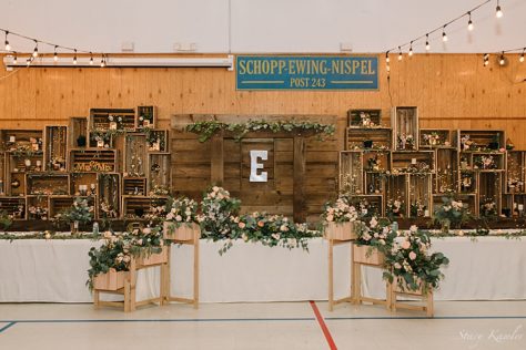 Head table with wooden boxes and rustic chic wedding decor