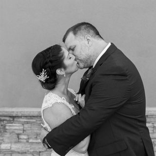 Kissing photo of newly married couple