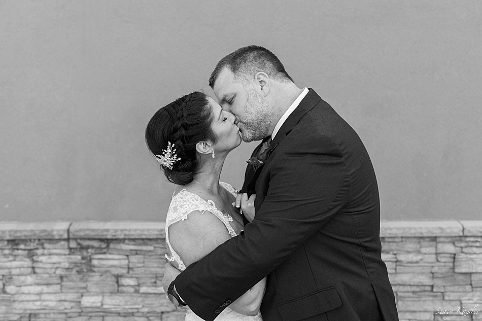 Kissing photo of newly married couple